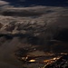 Nachtaufnahme vom Heinzer Berg II - Thusis umgeben von Wolken.