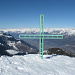 La croce di vetta e la Valtellina sullo sfondo