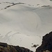 Piz Paradisin / Pizzo Paradisino (3302,2m):<br /><br />Wie ein eingeschneiter Krater schaut der namenlose westsüdwestlich des Gipfels aus der Vogwelperspektive aus.