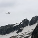 ...Nonostante il meteo non eccellente un elicottero appare sul crinale Ita|Ch proveniente dal versante Svizzero