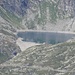 Lago di Cingino 2.250m; i puntini sul muro della diga sono stambecchi alla ricerca di salnitro