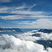 Dunst im Rheintal, darüber Cumuls und ganz oben Cirruswolken, ein Naturschauspiel!<br />Ganz hinten die Bernina-Gruppe.