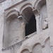 Particolare della torre campanaria della chiesa di San Biagio a Nonio con una trifora parzialmente tamponata.