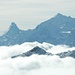 Matterhorn mit Weisshorn, aus dem Nebel ragt das Foggenhorn