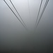 Blick aus der Bergstation Männlichen (2229 m), wo die Seile ins Nebelgrau abtauchen. Nun müssen auch wir uns von der Sonne verabschieden.