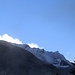 Smette di nevicare e per pochi minuti il sole si affaccia sul Pizzo Magn, alta Val Cava