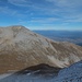 Near the top of Vihren. On the opposite side, Kutelo. Down in the valley, Razlog, Banya and Bansko. To the left, the highest mountains of the Balkans: Rila. To the righ, the Rhodopes. And, almost not visible in the far background, the Carpathians.