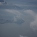 Zucco di Sileggio, cima - E dalle nubi spunta la penisola di Bellagio