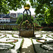 Ziehbrunnen (Barock/Rokoko ca. 1700) Schiedeeiserner Aufbau mit Weltkugel, Brunnenbassin aus Vulkantuffgestein, ca. 1924 im Garten aufgestellt.