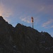Leuchtende Wolken und Gipfelkreuz der Zugspitze - mit 2962,06m der höchste Gipfel Deutschlands.