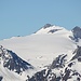 <b>Basòdino (3272 m).<br />Mi fermo spesso per ammirare e fotografare le cime note, nonché i ghiacciai che svettano ad ovest. Mi affascina quello del Basòdino, ancora nella veste invernale, con una evidente traccia che lo attraversa in corrispondenza del percorso estivo. </b>