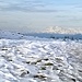 Neve all Alpe di Lenno e il Monte Rosa assieme alle grandi Alpi arricchiscono la panoramica.