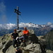 croce di vetta: dietro alla coppia di "alpini" il monte Disgrazia: Tilde e Giuseppe