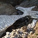 ... attraversiamo un pezzo di neve ghiacciata sotto una grande cascata proveniente dal Ghiacciaio Piccolo di Croslina...