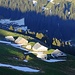 Die letzten Sonnenstrahlen über den Hütten der Alp Sigel