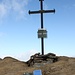 Croce di vetta della Punta dei Camosci (3044 m), con gamella e libro.