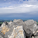 die Aussicht vom Öhrli über dem Gipfelsteinmann; Fotos waren wegen der extremen Windböen von bis zu 140 km/h nur in geduckter Haltung möglich