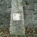Pietra incisa all'esterno del muro perimetrale del cimitero.