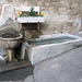 A Rovio ci imbattiamo in questa fontana ricavata da un sarcofago del III secolo.