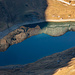 Zoom zum Spilauersee mit schönen Reflexionen vom Hundstock