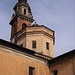 Chiesa dei Santi Giorgio ed Andrea a Carona con cupola a tamburo e campanile datato 1662 - 1664 con coronamento ottagonale a volute di stile barocco e cupola a guance concave.
