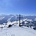 Gipfelkreuz Haglere mit schön verschneitem Hintergrund
