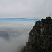 Le bastionate del Monte Due Mani sorgono dalla nebbia. (foto Monica)