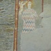 Una santa in ricchi abiti e nell'atto di essere incoronata, probabilmente Santa Caterina d'Alessandria.