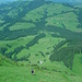 Steile Grashalden über der Emmentaler Hügellandschaft