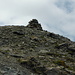 The cairn at the summit of Piz Curvér.