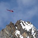 The rescue helicopter hovers by the Nadelhorn summit. Thankfully, there did not seem to be any emergency.