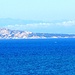 Die Insel "Capo Testa" mit "Korsika" am Horizont.