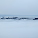 ein Nebelfall über der Gipfelkette des grossen Walsertals
