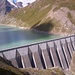 The Sabbione lake dam as seen from the Mores hut area. You may identify, on the opposite side, the path leading to the Claudie e Bruno hut.