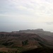 Die Papagayo Halbinsel bildet den suedlichsten Zipfel von Lanzarote. Im Vordergrund die caldera des ehemaligen Vulkans. Am Horizont die Insel Fuertaventura.