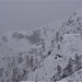 L'Alpe Corte si intravvede fra la foschia e la neve.