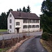 View of the old school building of Üssikon from Gigernweg.