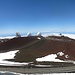 View of the observatories from the summit area. The landmass at the back is Haleakala on Maui.