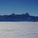 Nebelmeer im Winter mit Mangart und Jalouz