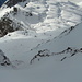 Steilstufe im P. Diei W-Grat: Tiefblick zum P. del Dosso und zum Skigebiet von Ciamporino