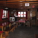 la sala pranzo: a sinistra il camino,le scale che conducono alla camerata,a destra,non si vede,c'è anche una stufa a legna per il riscaldamento