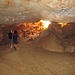 La grotta sotto al nuraghe, che presenta entrata e uscita in due punti diversi. In tutta la zona dell’Ogliastra, dove i rilievi sono prevalentemente calcarei, le grotte sono veramente numerose.