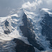 Ein erster Blick zum Piz Palü - Noch im Wechsel aus Sonne und Wolken