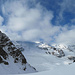 Piz Trovat (3145m) vor den gerade in den Wolken verborgenen Riesen des Bernina-Massivs.
