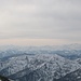 Winterliche Berge: über dem Großglockner (links) und dem Großvenediger (rechts) hängen triste Wolkenschleier, dazu bläst ein böig-kalter Wind.