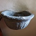 L'acquasantiera in granito della chiesa di Santa Maria.