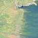 Lake Voralp and two hikers seen from Schlösslichopf