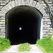 Der Tunnel Richtung Roveredo. <br />Wenn man aus der grellen Sonne kommt, ist es drinnen - trotz mitgebrachter Lampe - zappenduster