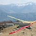 Alpe Mognone in una cornice di nastri segnavia  al vento,alle spalle monte Bar