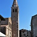 La basilica di Sant'Eufemia. Il campanile del '400 è sormontato da una statua di San Michele Arcangelo del 1462.